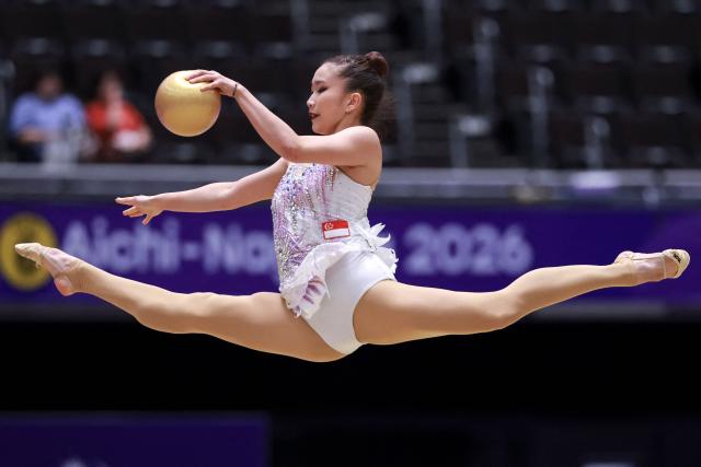 Singapore’s Yang Mikayla Angeline competes in the individual ball of the rhythmic gymnastics qualification round during the 2026 Asian Games at the Nagoya General Gymnasium in Nagoya on October 1, 2026. (Photo by DAVID GRAY / AFP)