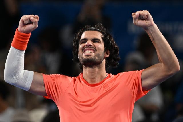Spain's Carlos Alcaraz celebrates beating USA's Alex Michelsen in their men's singles tennis match at the ATP Tour Japan Open Tennis Championships at the Ariake Tennis Forest Park in Tokyo on October 1, 2026. (Photo by Rie KIKUCHI / AFP)
