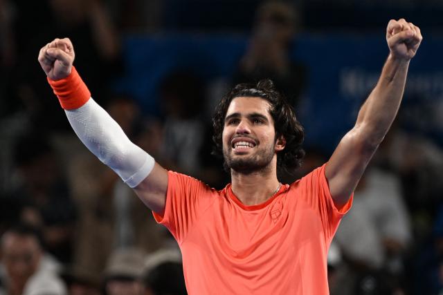 Spain's Carlos Alcaraz celebrates beating USA's Alex Michelsen in their men's singles tennis match at the ATP Tour Japan Open Tennis Championships at the Ariake Tennis Forest Park in Tokyo on October 1, 2026. (Photo by Rie KIKUCHI / AFP)