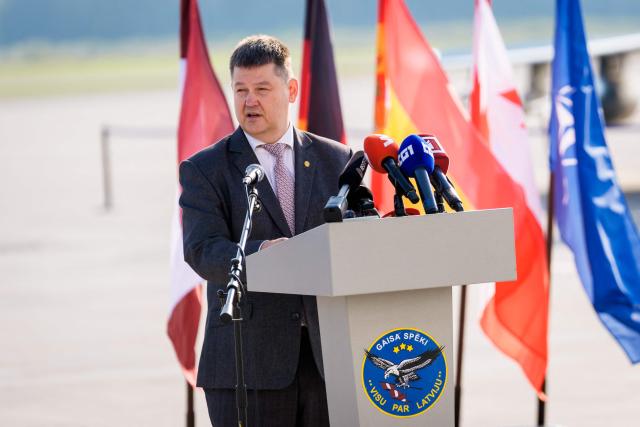 State Secretary at the Latvia's Ministry of Defence Airis Rikveilis gives a speech during the NATO Media day at Lielvarde Air Base in Lielvarde, Latvia, on October 1, 2026, before the upcoming parliamentary elections. Latvia goes to the polls for parliamentary elections on October 3, 2026, as the war in Ukraine drags into its fifth year. (Photo by Gints Ivuskans / AFP)