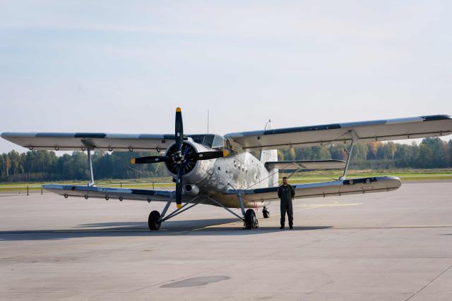 A Soviet-designed Antonov An-2 biplane of the Latvian Air Force is displayed during the NATO Media Day at Lielvarde Air Base in Lielvarde, Latvia, on October 1, 2026, ahead of the country's parliamentary elections. Latvia goes to the polls for parliamentary elections on October 3, 2026, as the war in Ukraine drags into its fifth year. (Photo by Gints Ivuskans / AFP)