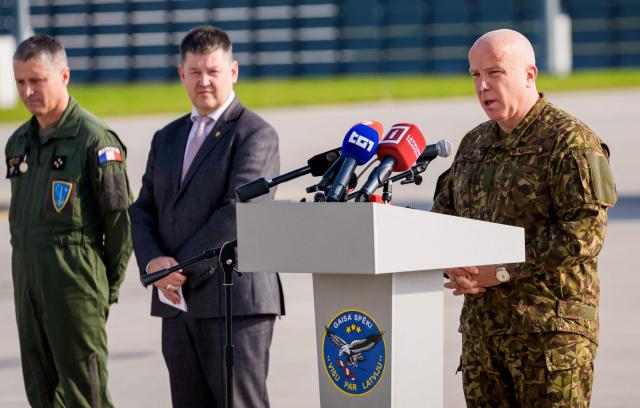 Latvian National Armed Forces Deputy Chief of Staff for Operations, Joint Headquarters Brigadier General Gunars Kaulins gives a speech during the NATO Media day at Lielvarde Air Base in Lielvarde, Latvia, on October 1, 2026, before the upcoming parliamentary elections. Latvia goes to the polls for parliamentary elections on October 3, 2026, as the war in Ukraine drags into its fifth year. (Photo by Gints Ivuskans / AFP)