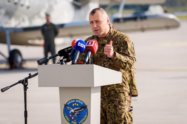 Latvian Air Force Commander Colonel Edmunds Svencs gives a speech during the NATO Media day at Lielvarde Air Base in Lielvarde, Latvia, on October 1, 2026, before the upcoming parliamentary elections. Latvia goes to the polls for parliamentary elections on October 3, 2026, as the war in Ukraine drags into its fifth year. (Photo by Gints Ivuskans / AFP)