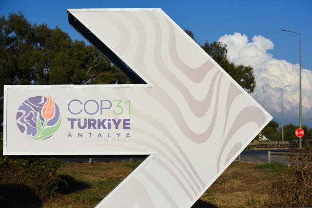 This photograph shows a direction sign reading "COP31 Antalya" near the entrance of Antalya Expo venue in Antalya on September 30, 2026, where the 2026 United Nations Climate Change Conference (COP31) will be held in Antalya. Turkey will host the COP31 climate talks from November 9 till 20 in the Mediterranean resort of Antalya. (Photo by Goksel YAPAR / AFP)