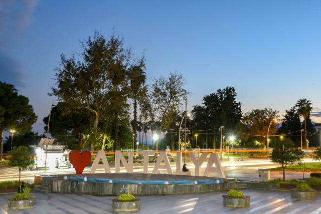 This photograph shows a sign reading "I love Antalya" near a park in Kaleici district Antalya, on September 30, 2026, where the 2026 United Nations Climate Change Conference (COP31) will be held in Antalya. Turkey will host the COP31 climate talks from November 9 till 20 in the Mediterranean resort of Antalya. (Photo by Goksel YAPAR / AFP)