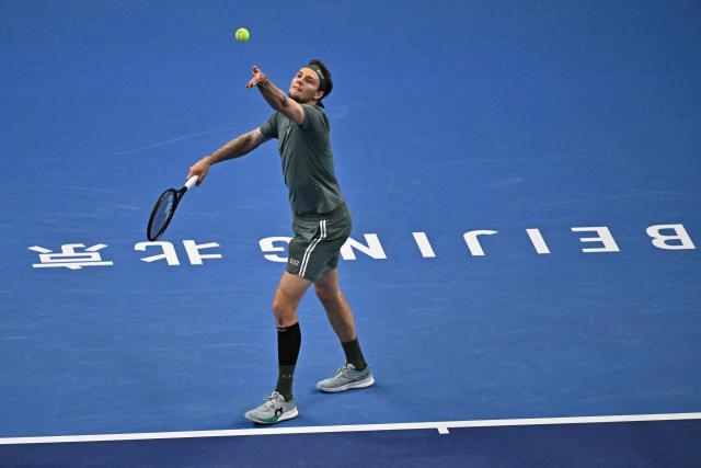 Kazakhstan's Alexander Bublik serves to Czech Republic's Jakub Mensik during their men's singles match at the China Open tennis tournament in Beijing on October 1, 2026. (Photo by Pedro PARDO / AFP)