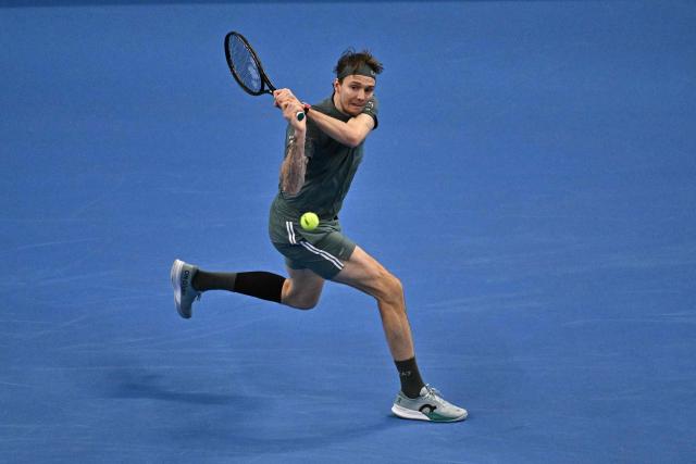 Kazakhstan's Alexander Bublik hits a return to Czech Republic's Jakub Mensik during their men's singles match at the China Open tennis tournament in Beijing on October 1, 2026. (Photo by Pedro PARDO / AFP)