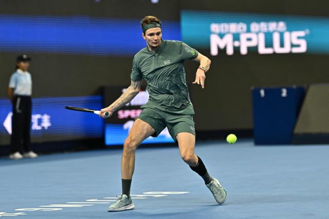 Kazakhstan's Alexander Bublik hits a return to Czech Republic's Jakub Mensik during their men's singles match at the China Open tennis tournament in Beijing on October 1, 2026. (Photo by Pedro PARDO / AFP)