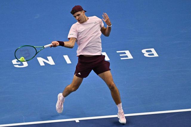 Czech Republic's Jakub Mensik hits a return to Kazakhstan's Alexander Bublik during their men's singles match at the China Open tennis tournament in Beijing on October 1, 2026. (Photo by Pedro PARDO / AFP)