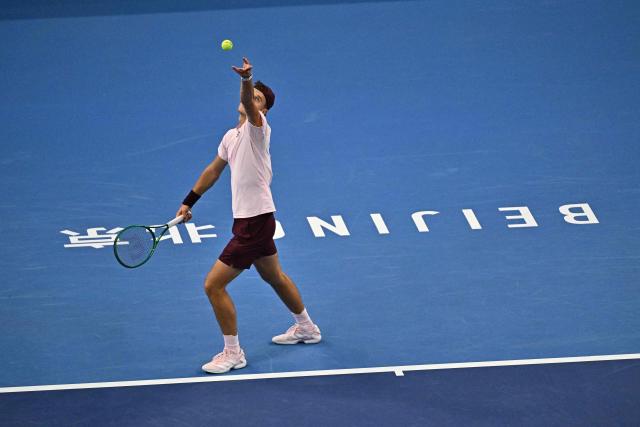 Czech Republic's Jakub Mensik serves to Kazakhstan's Alexander Bublik during their men's singles match at the China Open tennis tournament in Beijing on October 1, 2026. (Photo by Pedro PARDO / AFP)