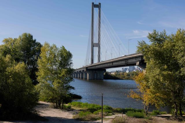 This photograph shows the South Bridge following a drone strike in Kyiv on October 1, 2026, amid the Russian invasion of Ukraine. Russian drones on October 1, 2026, hit a major bridge in Kyiv for the first time since the start of the conflict with Ukraine, as Moscow stepped up its attacks on key infrastructure ahead of winter. The twin strikes happened on the Southern Bridge -- a transport artery connecting the east and west of the Ukrainian capital over the Dnipro river. (Photo by Tetiana DZHAFAROVA / AFP)