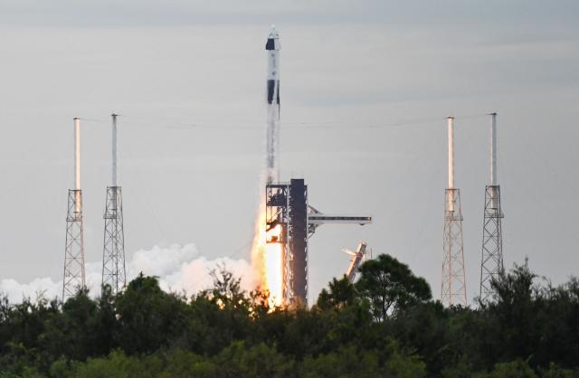 SpaceX Falcon 9 rocket topped with the Crew Dragon capsule lifts off for NASA's SpaceX Crew-13 mission from Space Launch Complex 40 at Cape Canaveral, Florida on October 1, 2026. NASA astronauts Jessica Watkins and Luke Delaney, CSA (Canadian Space Agency) astronaut Joshua Kutryk and Roscosmos cosmonaut Sergey Teteryatnikov are heading to the International Space Station as part of NASA's SpaceX Crew-13 mission to perform research, technology demonstrations and maintenance aboard the orbiting laboratory. (Photo by Gregg Newton / AFP)