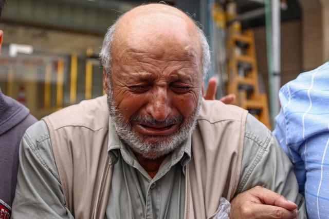 Father of Palestinian Mashhour Yassin, 51, grieves at the Salfit Hospital in Salfit in the Israeli-occupied West Bank on October 1, 2026, after his son was shot dead by Israeli settlers during a raid on the village of Yasuf southwest of Nablus, according to the mayor and the Palestinian health ministry. The raid came as international criticism mounts over surging levels of settler violence against Palestinians in the territory, which Israeli Prime Minister Benjamin Netanyahu downplayed last week. Israel's military told AFP it was looking into the details of the attack. (Photo by JAAFAR ASHTIYEH / AFP)