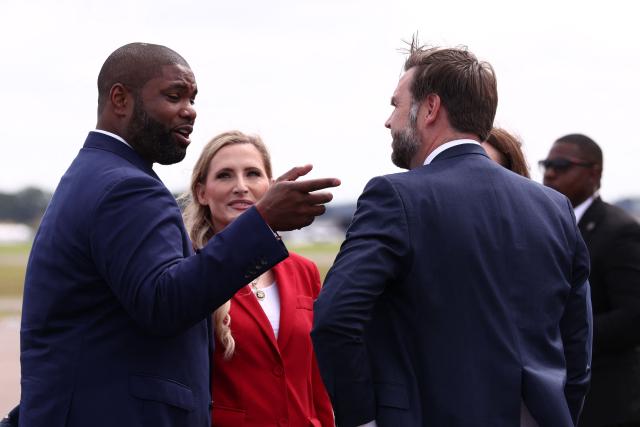 US Vice President JD Vance speaks to the Florida gubernatorial candidate Byron Donalds (L) upon arrival in Lakeland, Florida, US, October 1, 2026. (Photo by Kevin Lamarque / POOL / AFP)