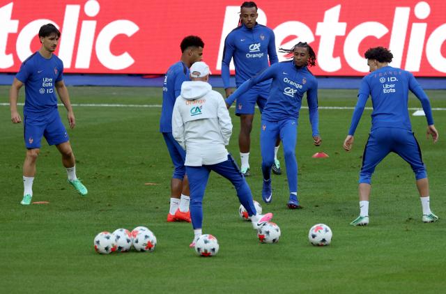 (From L) France's forward #19 Esteban Lepaul, France's forward #20 Desire Doue, France's defender #05 Jules Kounde, France's midfielder #11 Michael Olise and France's midfielder #18 Maghnes Akliouche attend a training session on the eve of their UEFA Nations League football match against Italy, at the Stade de France stadium in Saint-Denis, near Paris, on October 1, 2026. (Photo by FRANCK FIFE / AFP)