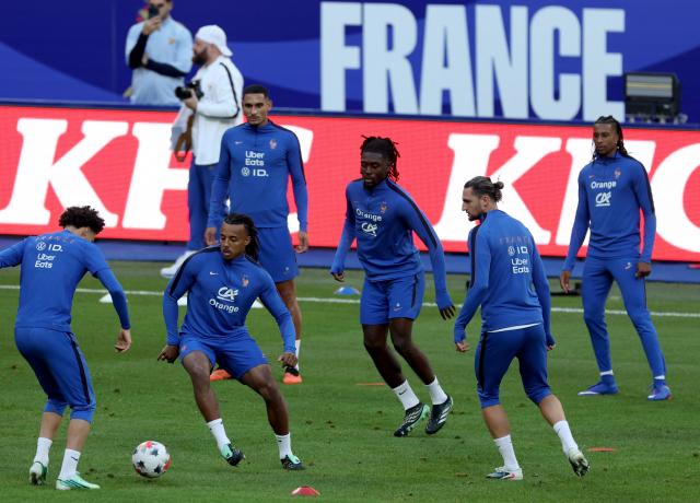 (From L) France's midfielder #18 Maghnes Akliouche, France's defender #05 Jules Kounde, France's defender #17 Maxence Lacroix, France's midfielder #08 Manu Kone, France's midfielder #14 Adrien Rabiot and France's midfielder #11 Michael Olise attend a training session on the eve of their UEFA Nations League football match against Italy, at the Stade de France stadium in Saint-Denis, near Paris, on October 1, 2026. (Photo by FRANCK FIFE / AFP)