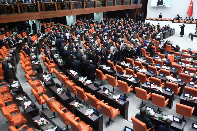 Members of the New Party (Yeni Parti) leave the chamber as Turkish President Recep Tayyip Erdogan delivers a speech during the opening of the parliamentary session at the Grand National Assembly of Turkey (TBMM) in Ankara, on October 1, 2026. (Photo by ADEM ALTAN / AFP)