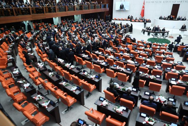 Members of the New Party (Yeni Parti) leave the chamber as Turkish President Recep Tayyip Erdogan delivers a speech during the opening of the parliamentary session at the Grand National Assembly of Turkey (TBMM) in Ankara, on October 1, 2026. (Photo by ADEM ALTAN / AFP)