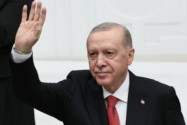 Turkish President Recep Tayyip Erdogan waves towards Turkish members of parliament after delivering a speech during the opening of the parliamentary session at the Grand National Assembly of Turkey (TBMM) in Ankara, on October 1, 2026. (Photo by Adem ALTAN / AFP)