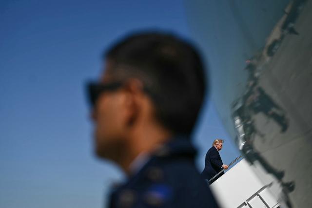 US President Donald Trump boards Air Force One at Joint Base Andrews, Maryland on October 1, 2026. Trump is travelling to Texas and Oklahoma to speak at campaign rallies. (Photo by Kent NISHIMURA / AFP)