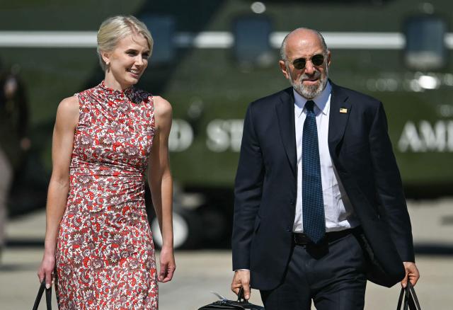 (L/R) Executive Assistant to the President Natalie Harp and US Secretary of Commerce Howard Lutnick walk to board Air Force One at Joint Base Andrews, Maryland on October 1, 2026. US President Donald Trump is travelling to Texas and Oklahoma to speak at campaign rallies. (Photo by Kent NISHIMURA / AFP)