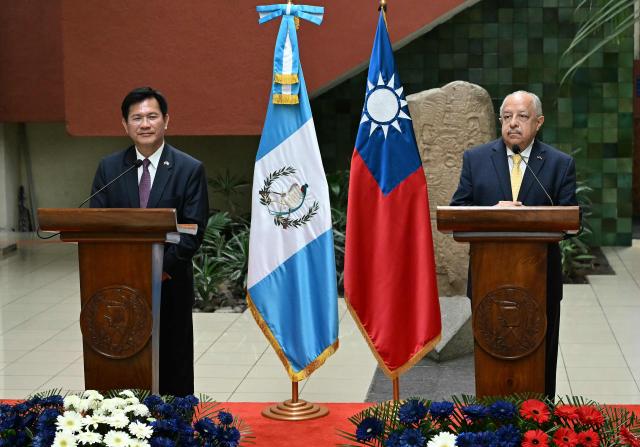 Taiwan's Foreign Minister Lin Chia-Lung (L) speaks during a joint press conference with his Guatemalan counterpart Carlos Martinez Alvarado at the Ministry of Foreign Affairs in Guatemala City on October 1, 2026. (Photo by JOHAN ORDONEZ / AFP)