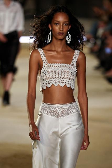 Danish model Mona Tougaard presents a creation for Isabel Marant Women's Spring/Summer 2027 collection fashion show as part of the Paris Fashion Week, in Paris on October 1, 2026. (Photo by SIMON WOHLFAHRT / AFP)