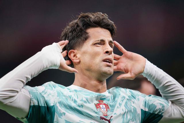 Portugal's defender #20 Joao Cancelo celebrates scoring the opening goal with his teammates during the UEFA Nations League Group A4 match between Denmark and Portugal at Parken stadium in Copenhagen on October 1, 2026. (Photo by Liselotte Sabroe / Ritzau Scanpix / AFP) / Denmark OUT