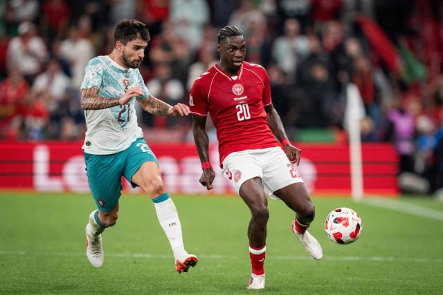 Denmark's midfielder #20 Mohamed Daramy (R) and Portugal's midfielder #21 Ruben Neves vie for the ball during the UEFA Nations League Group A4 match between Denmark and Portugal at Parken stadium in Copenhagen on October 1, 2026. (Photo by Sebastian Elias Uth / Ritzau Scanpix / AFP) / Denmark OUT