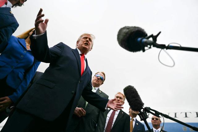 US President Donald Trump speaks to the press after stepping off from Air Force One at Dallas Fort Worth International Airport in Dallas, Texas, on October 1, 2026. Trump is travelling to Texas and Oklahoma to speak at campaign rallies. (Photo by Kent NISHIMURA / AFP)