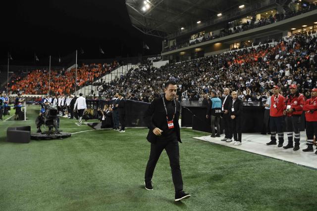 Netherlands' Spanish head coach Xavi Hernandez (C) walks on the pitch ahead of the UEFA Nations League Group A2 football match between Greece and The Netherlands at the Toumba Stadium in Thessaloniki on October 1, 2026. (Photo by Sakis Mitrolidis / AFP)