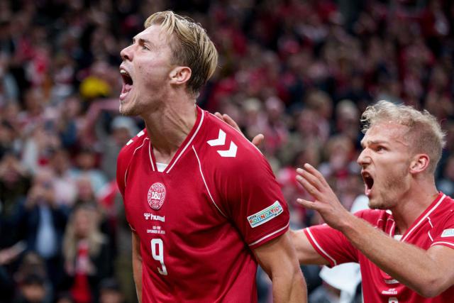 Denmark's forward #09 Rasmus Hojlund (L) celebrates after scoring Denmark's second goal during the UEFA Nations League Group A4 match between Denmark and Portugal at Parken stadium in Copenhagen on October 1, 2026. (Photo by Liselotte Sabroe / Ritzau Scanpix / AFP) / Denmark OUT