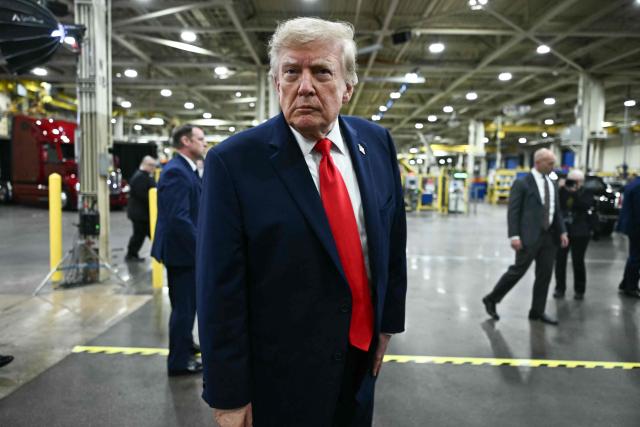 US President Donald Trump takes a question from the press at the Peterbilt Motors facility in Denton, Texas, on October 1, 2026. (Photo by Kent NISHIMURA / AFP)