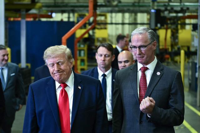 US President Donald Trump tours the Peterbilt Motors facility with the CEO of Paccar, Petebuilt's parent company, Preston Feight, in Denton, Texas, on October 1, 2026. (Photo by Kent NISHIMURA / AFP)