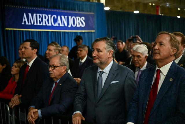 US Senator Ted Cruz (2nd R), Republican of Texas, listens to President Donald Trump deliver remarks at the Peterbilt Motors facility in Denton, Texas, on October 1, 2026. (Photo by Kent NISHIMURA / AFP)