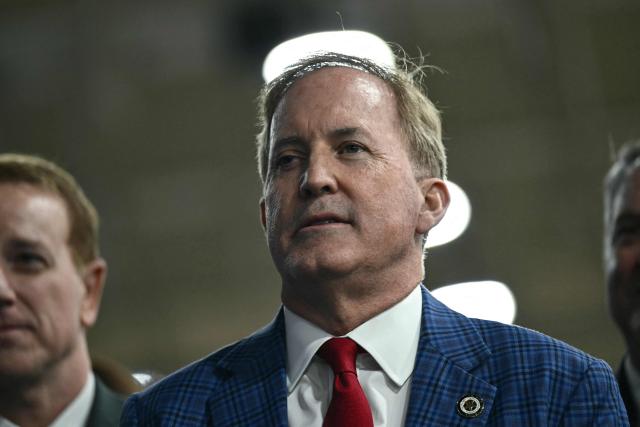 Texas Attorney General and US senatorial candidate Ken Paxton listens to US President Donald Trump delivers remarks at the Peterbilt Motors facility in Denton, Texas, on October 1, 2026. (Photo by Kent NISHIMURA / AFP)