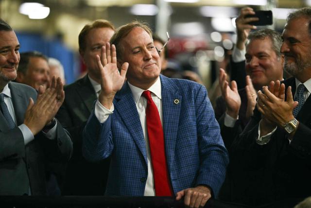Texas Attorney General and US senatorial candidate Ken Paxton waves before US President Donald Trump delivers remarks at the Peterbilt Motors facility in Denton, Texas, on October 1, 2026. (Photo by Kent NISHIMURA / AFP)