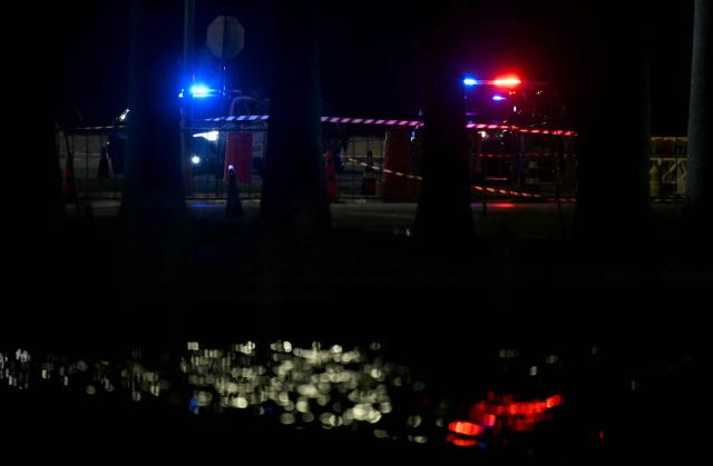 Brazilian police officers inspect the area of a possible bomb in a backpack outside the Supreme Court headquarters in Brasilia on October 1, 2026. Brazilian police are investigating a possible bomb placed in a backpack thrown outside the Supreme Court, the country's highest tribunal reported on October 1, 2026, three days before presidential elections begin. (Photo by Evaristo SA / AFP)