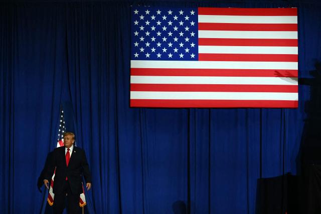 US President Donald Trump arrives to the stage to speaks during a campaign rally at the Choctaw Event Center in Durant, Oklahoma on October 1, 2026. Trump is campaigning for Republican gubernatorial nominee Mike Mazzei. (Photo by Kent NISHIMURA / AFP)