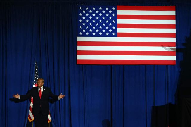 US President Donald Trump arrives to the stage to speaks during a campaign rally at the Choctaw Event Center in Durant, Oklahoma on October 1, 2026. Trump is campaigning for Republican gubernatorial nominee Mike Mazzei. (Photo by Kent NISHIMURA / AFP)