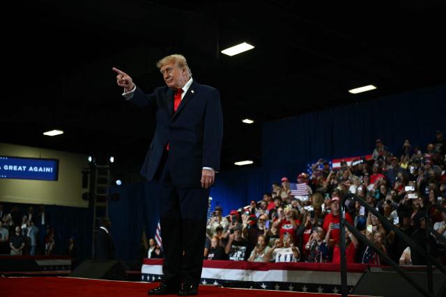 US President Donald Trump greets his supporters upon arrival to a campaign rally at the Choctaw Event Center in Durant, Oklahoma on October 1, 2026. Trump is campaigning for Republican gubernatorial nominee Mike Mazzei. (Photo by Kent NISHIMURA / AFP)