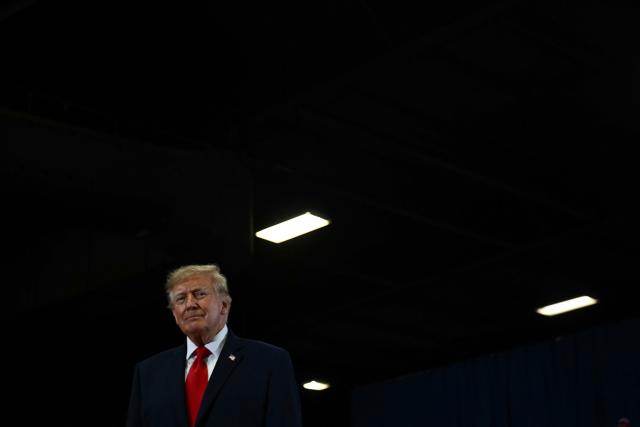 US President Donald Trump observes his supporters upon arrival to a campaign rally at the Choctaw Event Center in Durant, Oklahoma on October 1, 2026. Trump is campaigning for Republican gubernatorial nominee Mike Mazzei. (Photo by Kent NISHIMURA / AFP)
