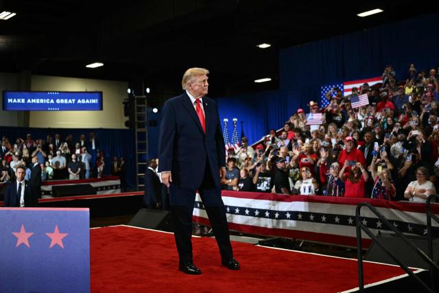 US President Donald Trump greets his supporters upon arrival to a campaign rally at the Choctaw Event Center in Durant, Oklahoma on October 1, 2026. Trump is campaigning for Republican gubernatorial nominee Mike Mazzei. (Photo by Kent NISHIMURA / AFP)