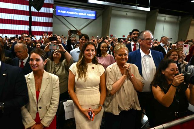 People watch as US President Donald Trump arrives to a campaign rally at the Choctaw Event Center in Durant, Oklahoma on October 1, 2026. Trump is campaigning for Republican gubernatorial nominee Mike Mazzei. (Photo by Kent NISHIMURA / AFP)