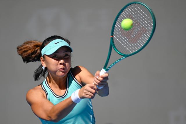 China's Yuan Yue hits a return to Russia's Mirra Andreeva during their women's singles second round tennis match at the China Open tennis tournament in Beijing on October 2, 2026. (Photo by WANG Zhao / AFP)