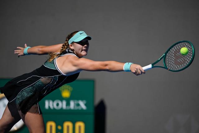 Russia's Mirra Andreeva hits a return to China's Yuan Yue during their women's singles match at the China Open tennis tournament in Beijing on October 2, 2026. (Photo by WANG Zhao / AFP)
