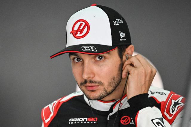 Haas F1 Team's French driver Esteban Ocon adjusts his earphones before the second practice session ahead of the Formula One Bahrain Grand Prix in Sepang on October 2, 2026. (Photo by Jade Gao / AFP)