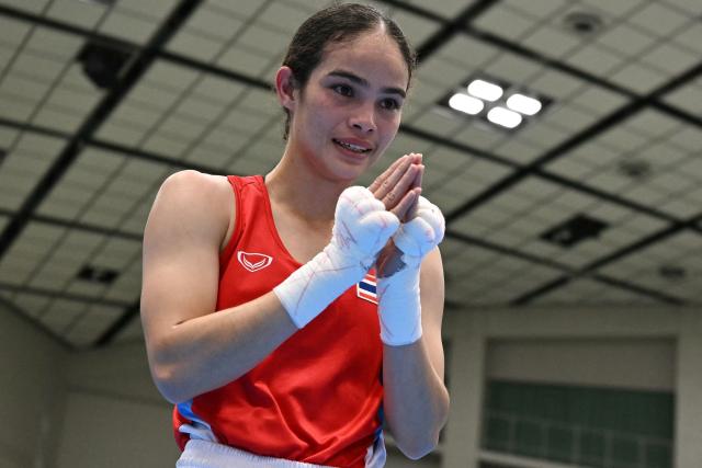 Thailand's Natnicha Chongprongklang gestures after beating North Korea's Pang Chol Mi in the women's 54kg gold medal boxing bout during the 2026 Asian Games at Nishio Gymnasium in Nishio on October 2, 2026. (Photo by MOHD RASFAN / AFP)
