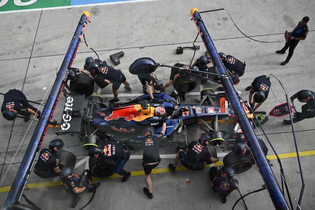 Red Bull Racing's Dutch driver Max Verstappen's crew changes the tyres of his car during the second practice session ahead of the Formula One Bahrain Grand Prix in Sepang on October 2, 2026. (Photo by JADE GAO / AFP)