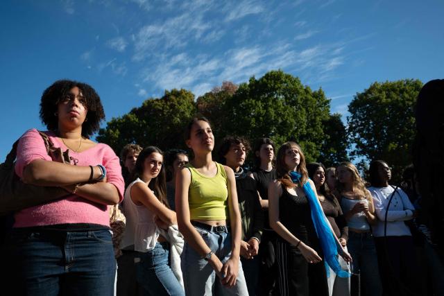 Students of Mandela's high school gather after a fire destroys the entrance of their school as protesting students carry out blockading action in Nantes, western France, on October 2, 2026. Since late September, students have staged protests outside schools over grievances ranging from timetables, class sizes and a shortage of teachers to overheated classrooms during this year's heatwaves. The protests started in the Ile-de-France region around Paris but have now spread to other cities nationwide. (Photo by Sebastien Salom-Gomis / AFP)